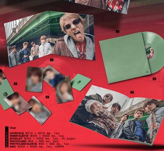 Vinyl record set with photos and packaging on a red background