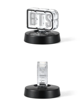Clear measuring device with black base on a white background
