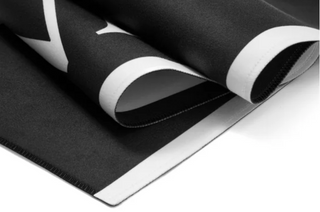 Roll of black and white vinyl with a brand logo on a white background