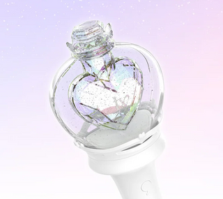 Heart-shaped bottle with a glowing effect on a light purple background
