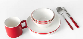 Red and white ceramic tableware set on a white background