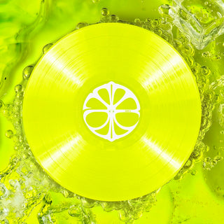 Yellow vinyl record with a white center design on a green background  aespa LEMONADE LP Version album cover