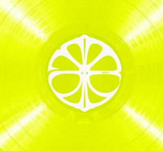 Close-up of a yellow vinyl record with a white logo. aespa LEMONADE LP vinyl record
