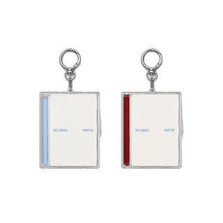 Two keychains with rectangular frames and labels on a white background